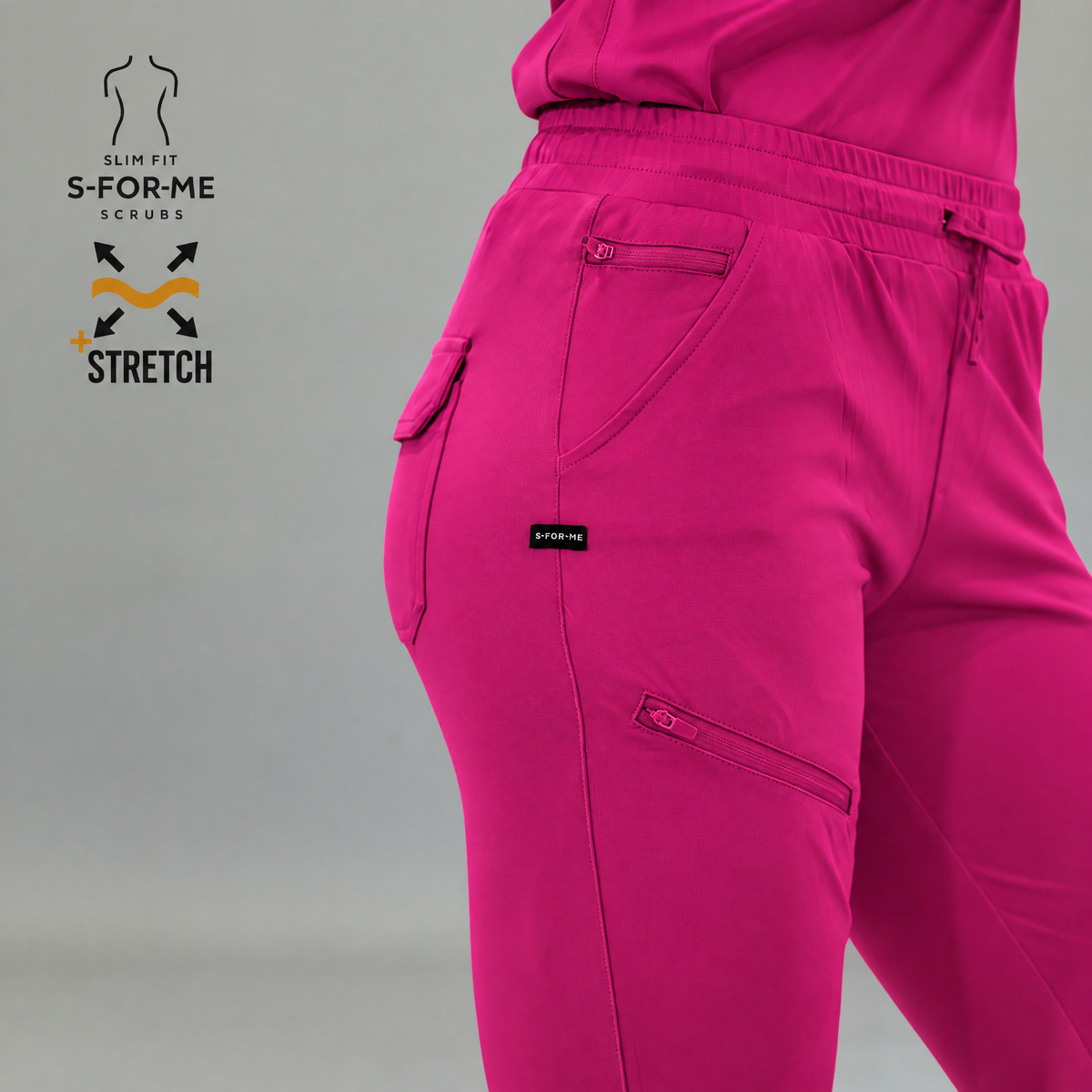 Front close-up of fuchsia Style 905 jogger scrub pants, drawstring waist and zippered pocket