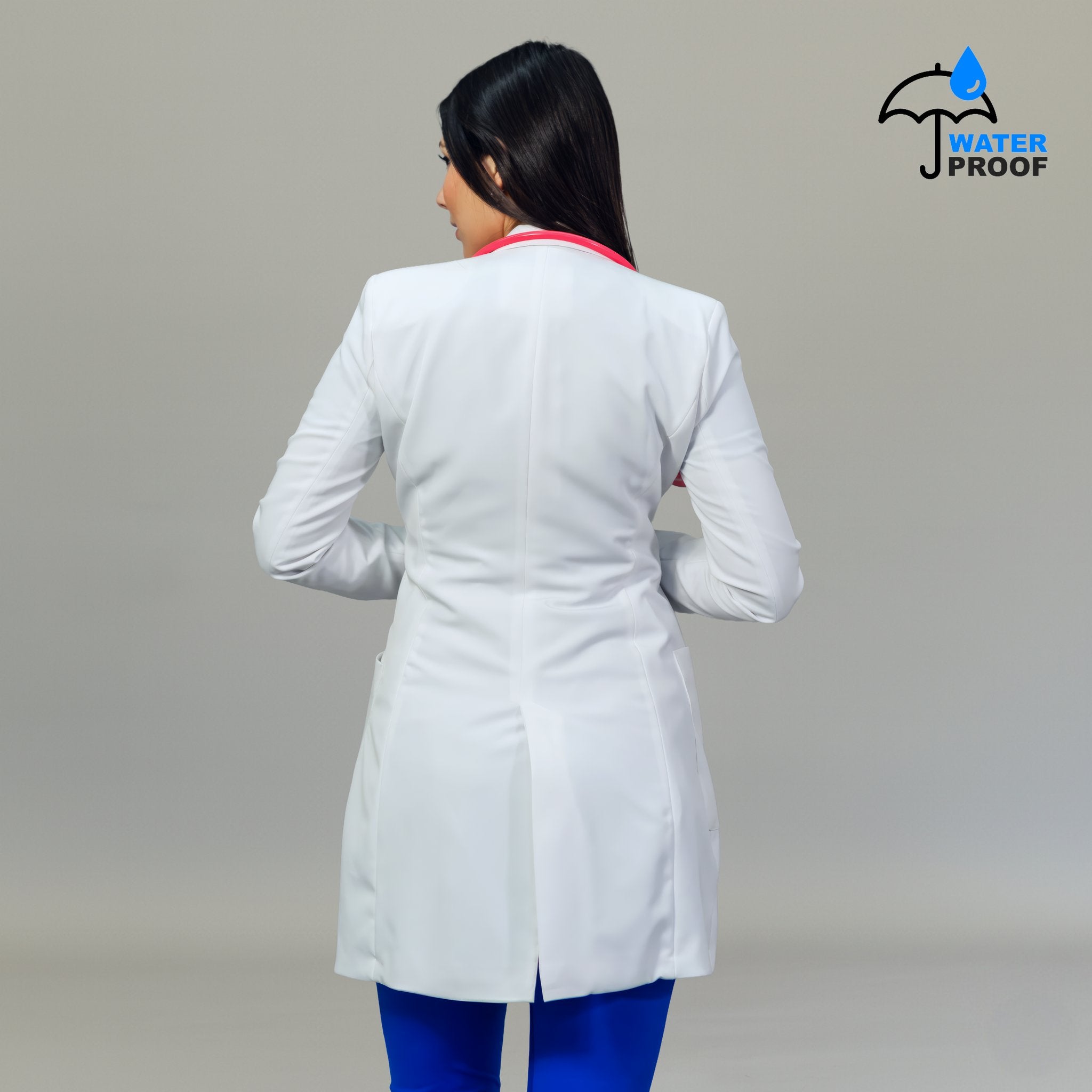 Back view of women’s white stretch lab coat with contoured seams and back vent