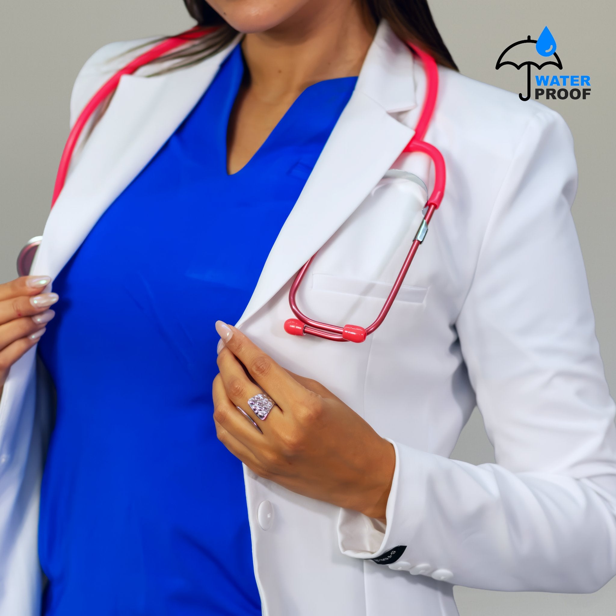 Close-up of women’s white lab coat with lapel chest pocket and waterproof finish