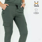 Close-up front view of the waist and front pockets on the jasper green 910 jogger pants.