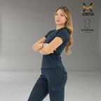 Side pose of women’s navy blue 905 scrub top showing professional fit