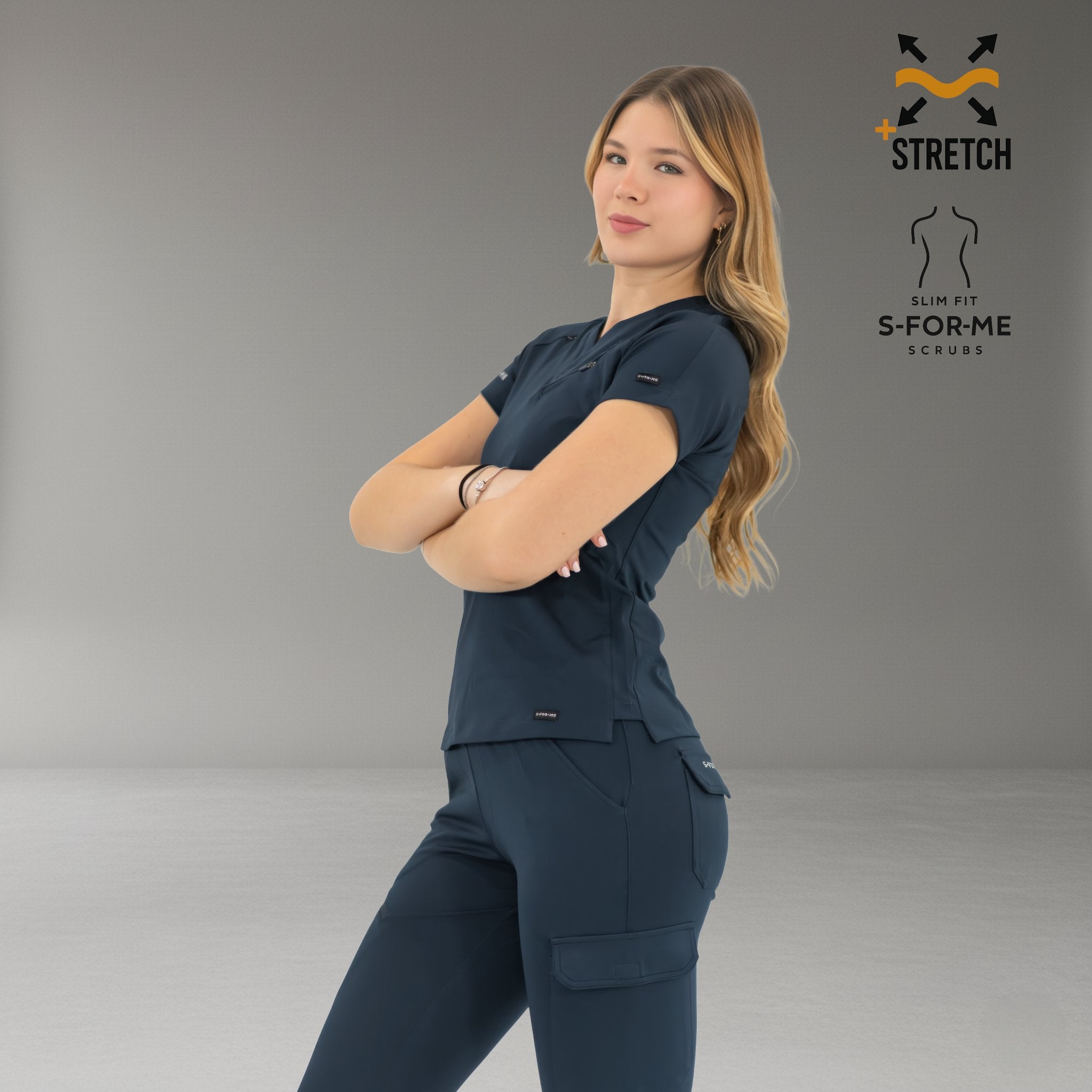 Side pose of women’s navy blue 905 scrub top showing professional fit