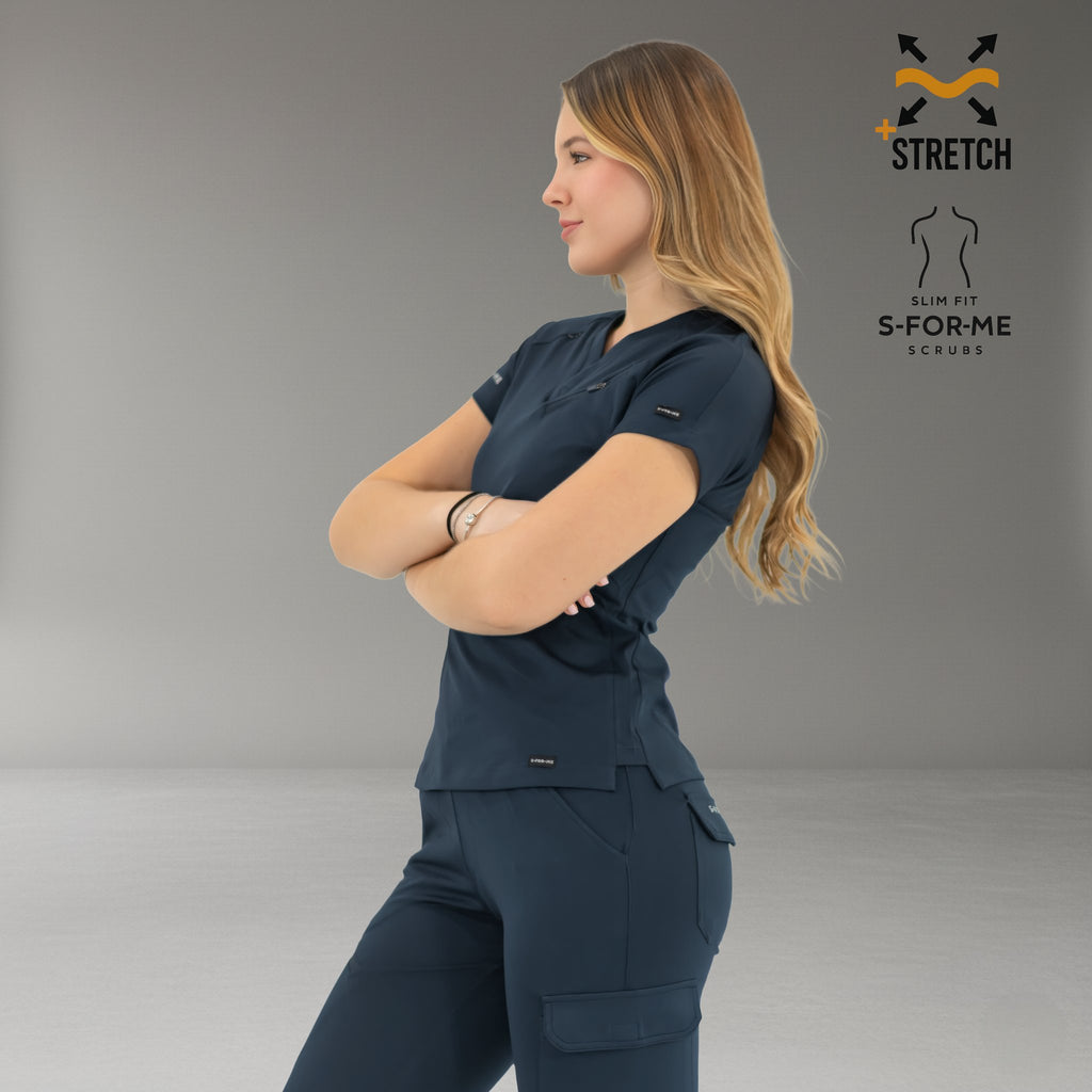 Profile view of women’s navy blue super stretch scrub top and pants