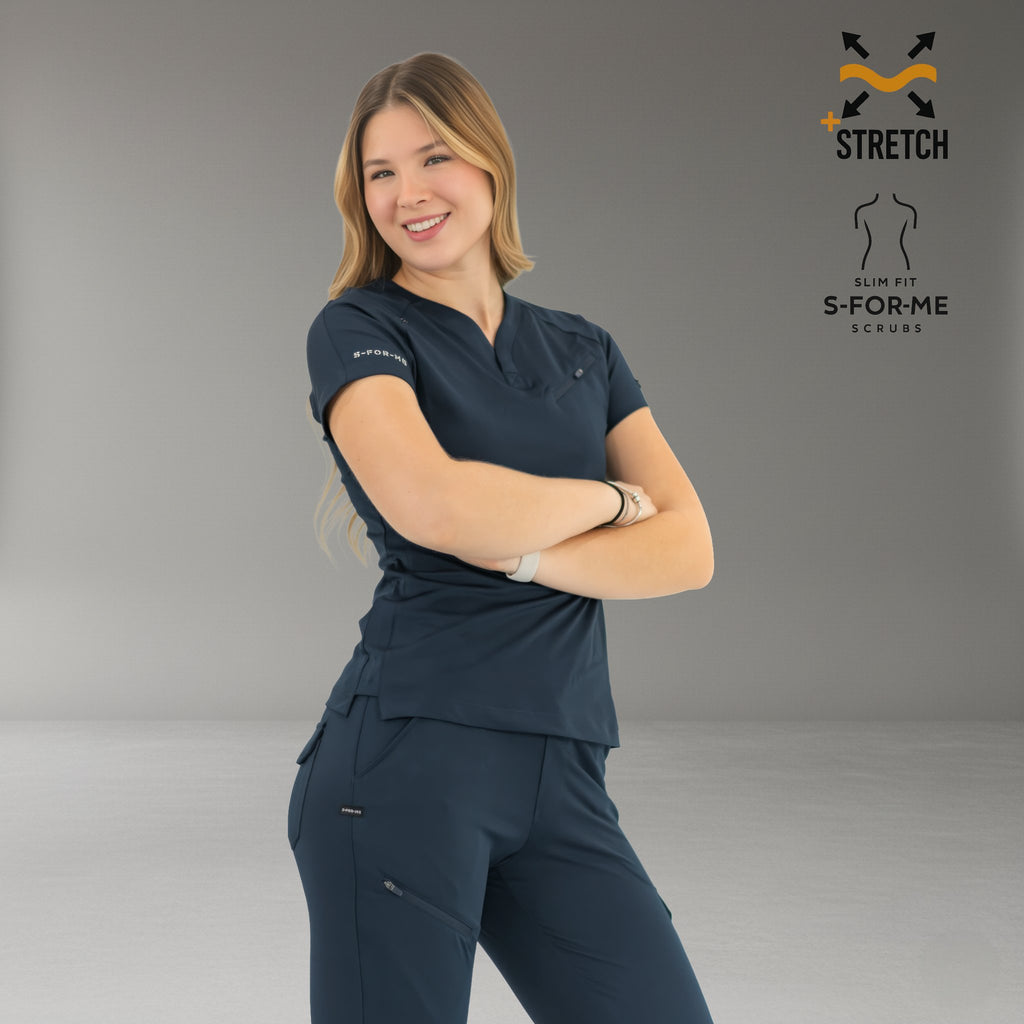 Side view of women’s 905 navy blue scrub top with matching scrub pants