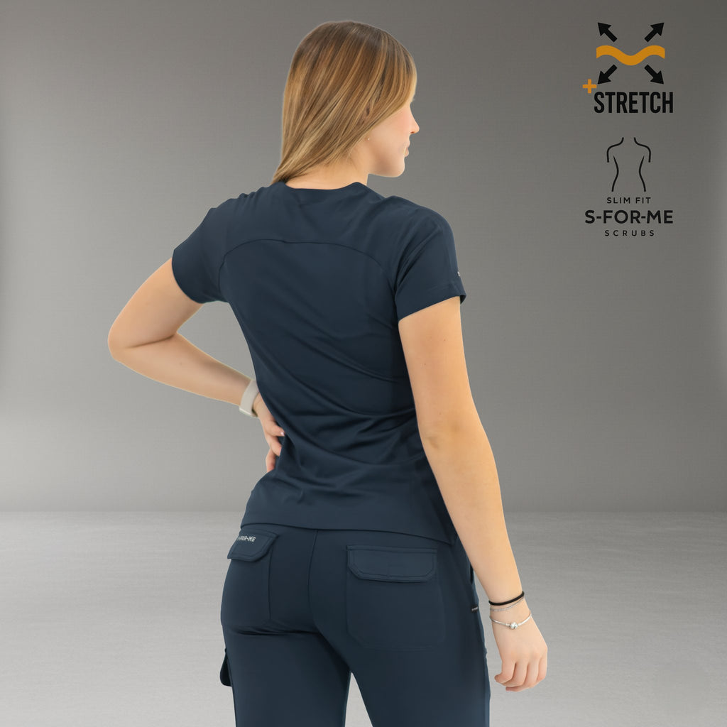 Back view of women’s navy blue scrub top with tailored slim fit
