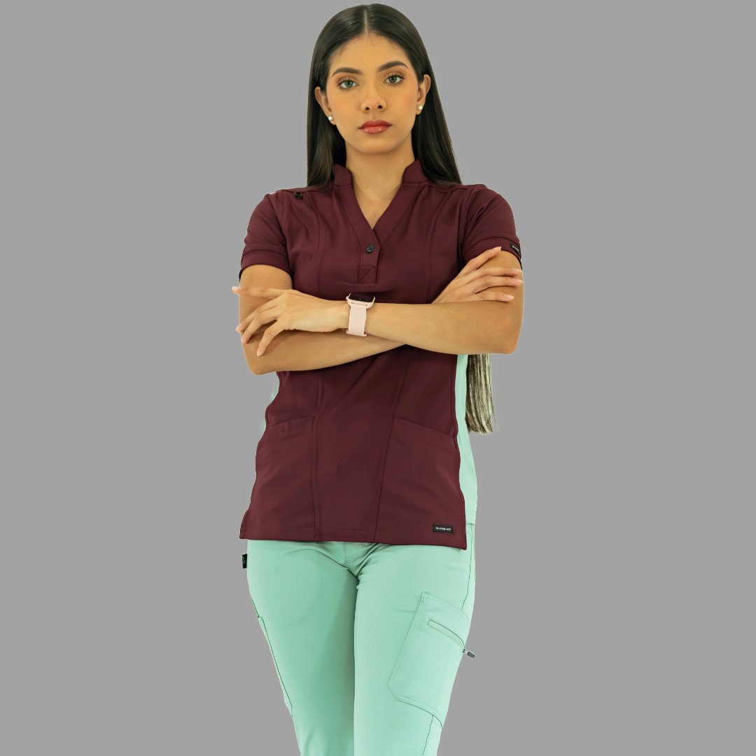 Close-up of pocket and seam details on Women's Top 930 Maroon/Brook Green scrub top