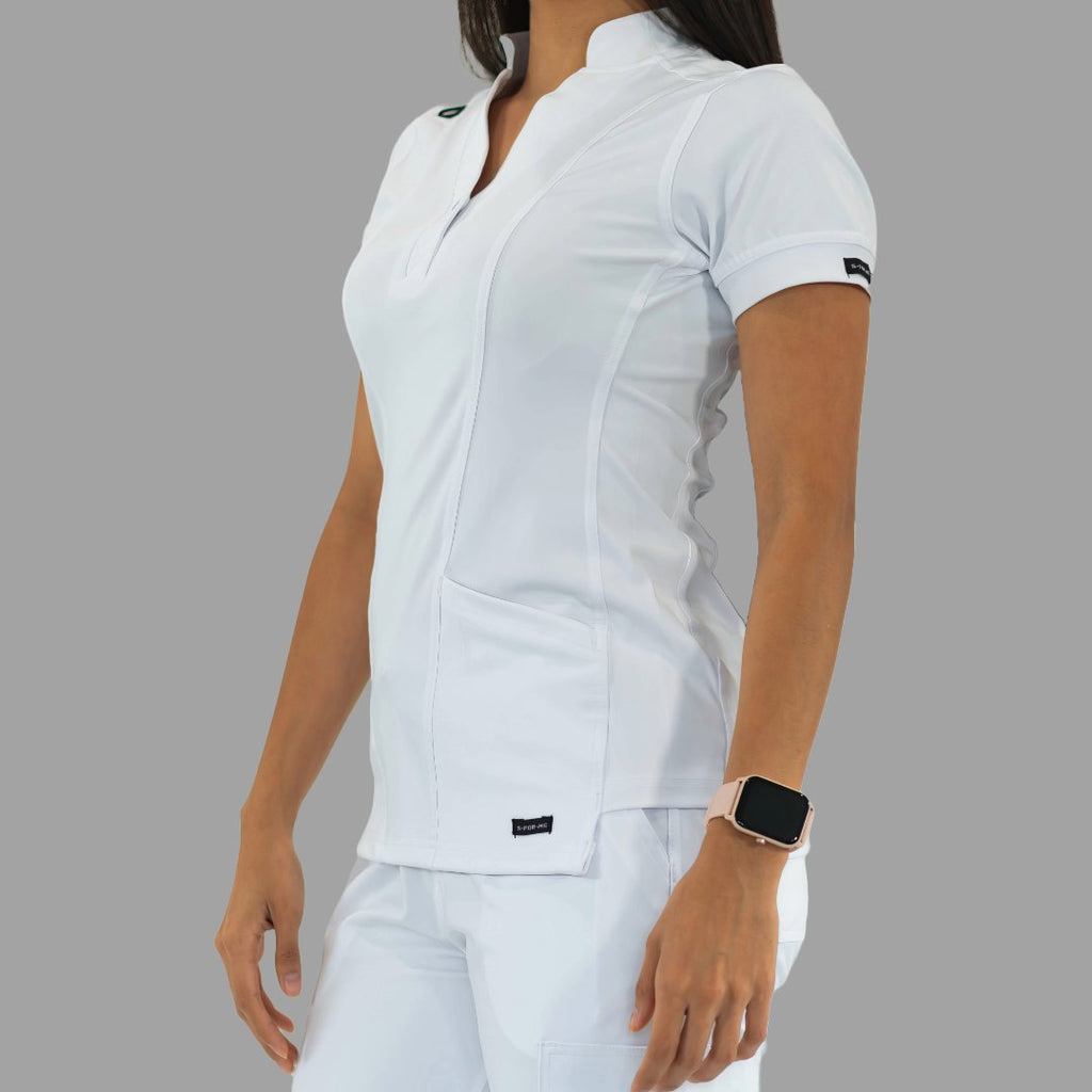 Women's white Style 930 scrub top, three-quarter view, model looking downward.