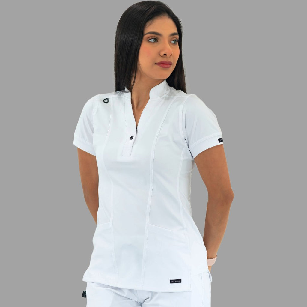 Women's white Style 930 scrub top, front view, model looking to the side.