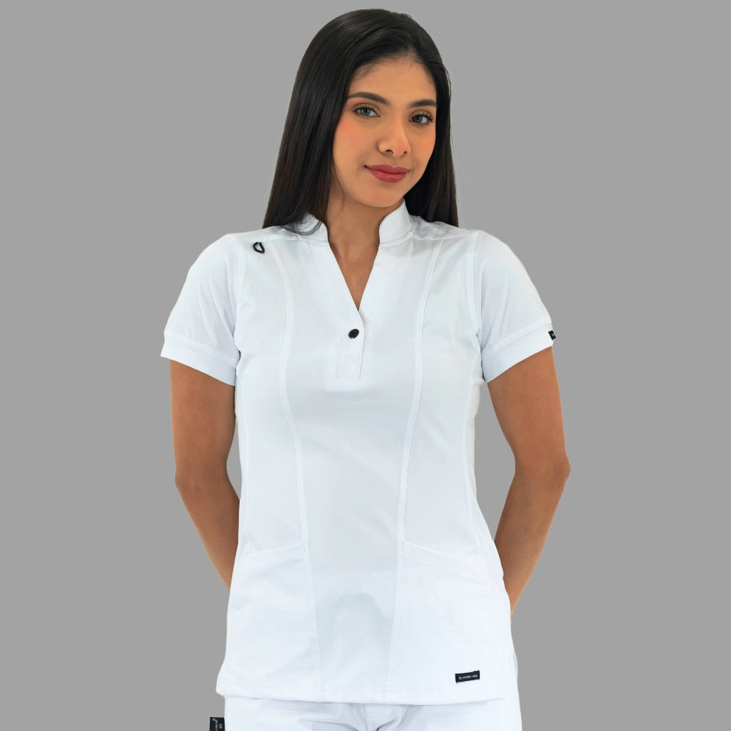Women's white Style 930 scrub top, front view, model looking straight ahead.