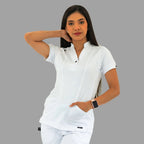 Women's white Style 930 scrub top, front view, model with one hand behind her head.