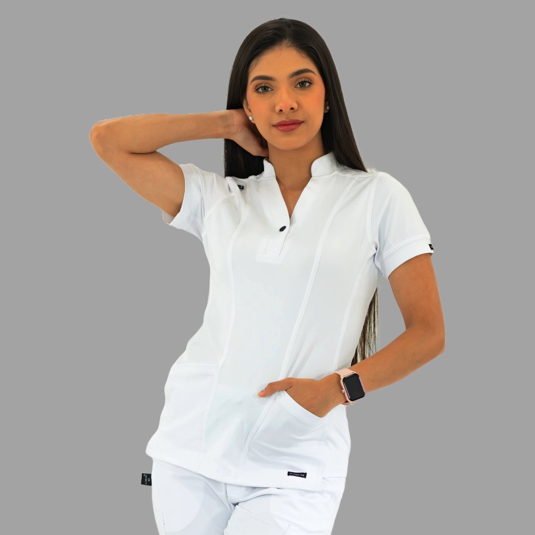 Women's white Style 930 scrub top, front view, model with one hand behind her head.