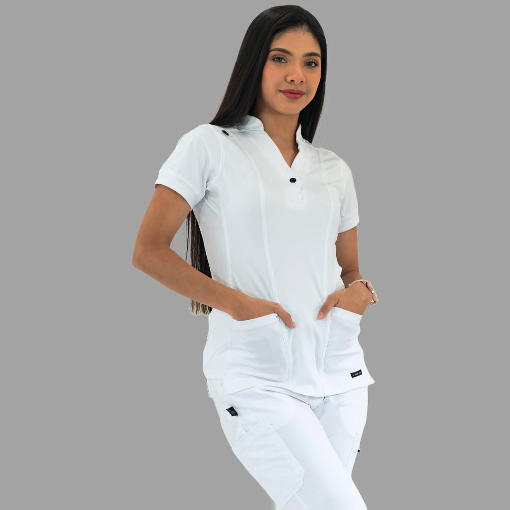 Women's white Style 930 scrub top, three-quarter view, model looking straight ahead.