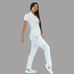 Women's white Style 930 scrub top and pants, full body view, model stepping forward.