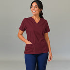 Women's maroon lightweight scrub top 502 V-neck with hand on hip — fluid-resistant medical uniform for nurses by S-FOR-ME