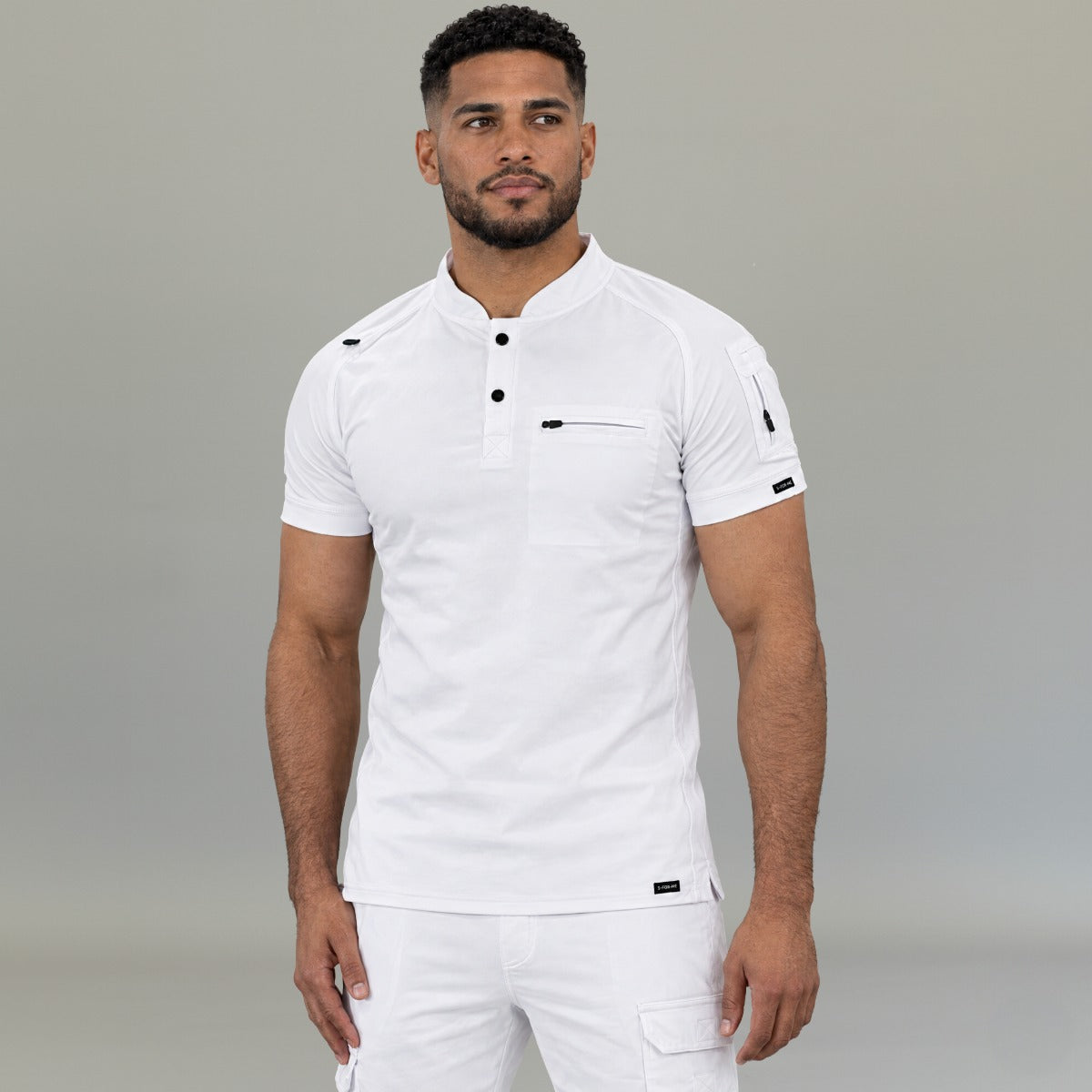 Close-up of men’s white medical scrub top with chest pocket