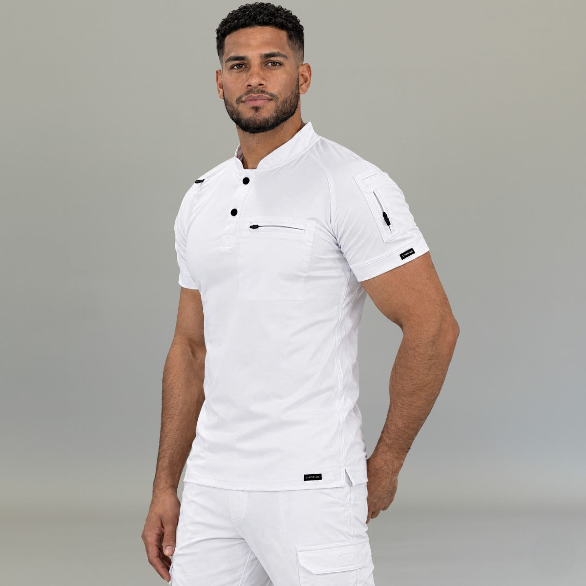 Side profile of men’s white athletic fit scrub top