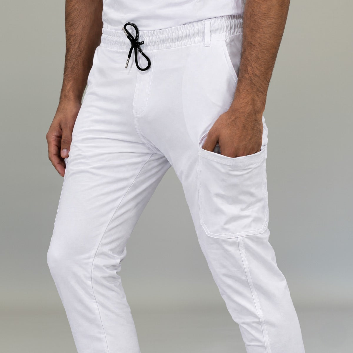 Close-up of men’s white medical scrub jogger pants waist and pockets