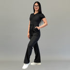 Angled front view of women’s Style 945 Black scrub jumpsuit