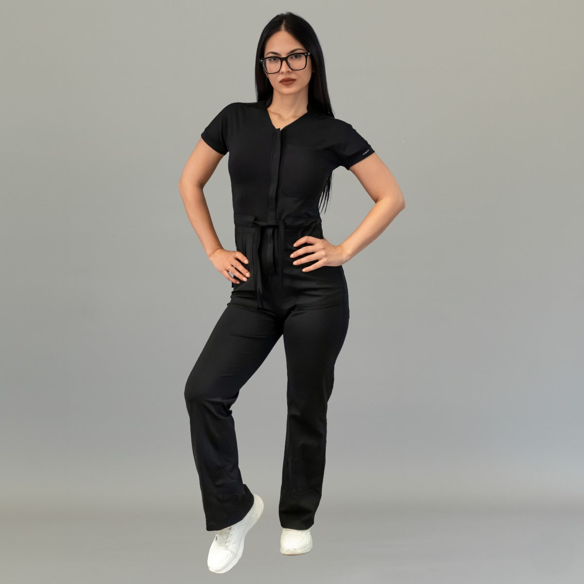 Full-length front view of women’s Black scrub jumpsuit