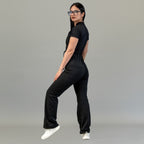 Three-quarter back view of women’s Black Super Stretch scrub jumpsuit