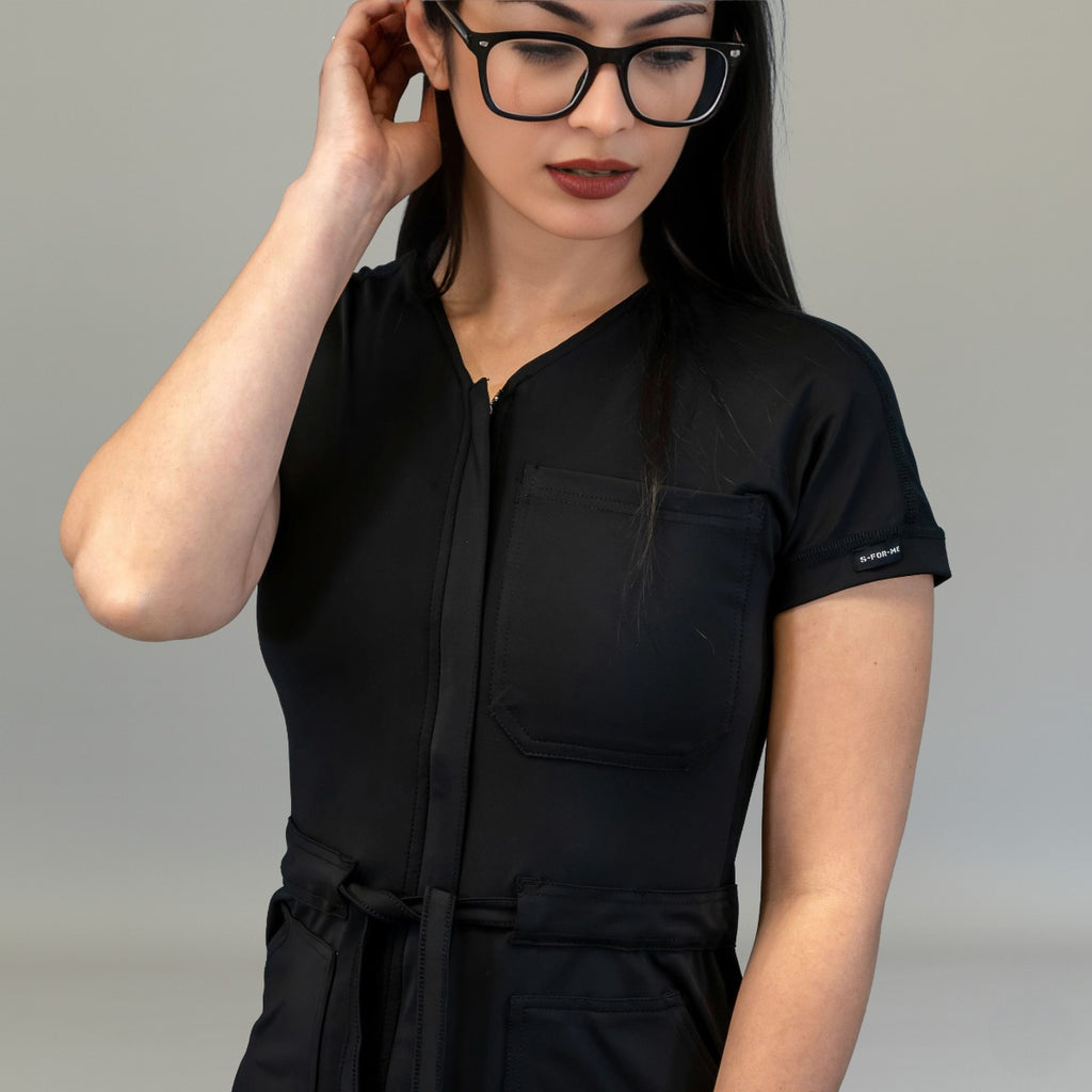 Front zipper, short sleeve and waist tie detail on Black scrub jumpsuit
