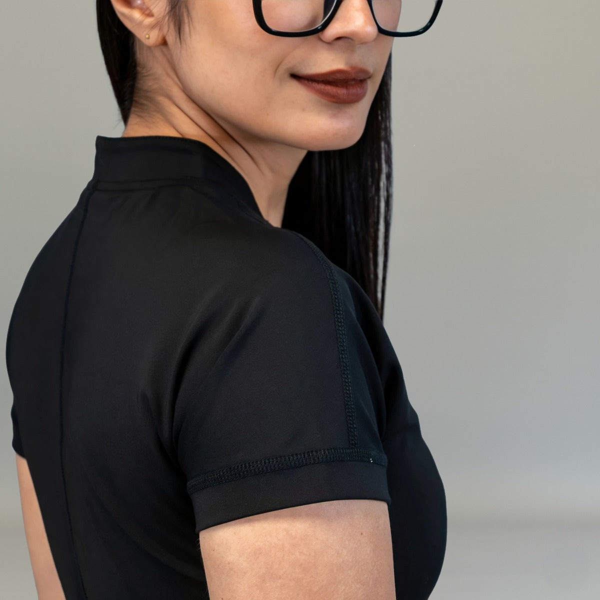 Close-up of short sleeve and shoulder on Black Style 945 jumpsuit