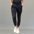 Front view of black 910 jogger pants with side cargo pockets and a drawstring waist.