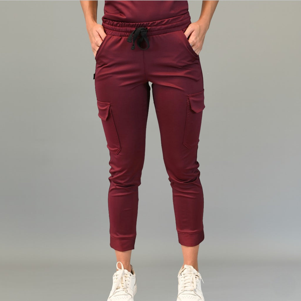 Front view of maroon jogger scrub pants with cargo pockets and elastic waistband.