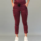 Front view of maroon jogger scrub pants with cargo pockets and elastic waistband.