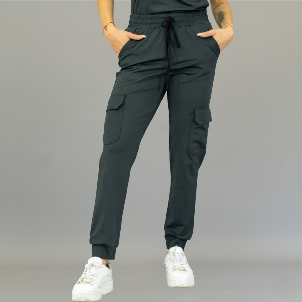 Front view of women's oxford gray scrub jogger pants with hands in pockets.