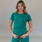 Front view of a women's surgical green super stretch scrub top, half length.