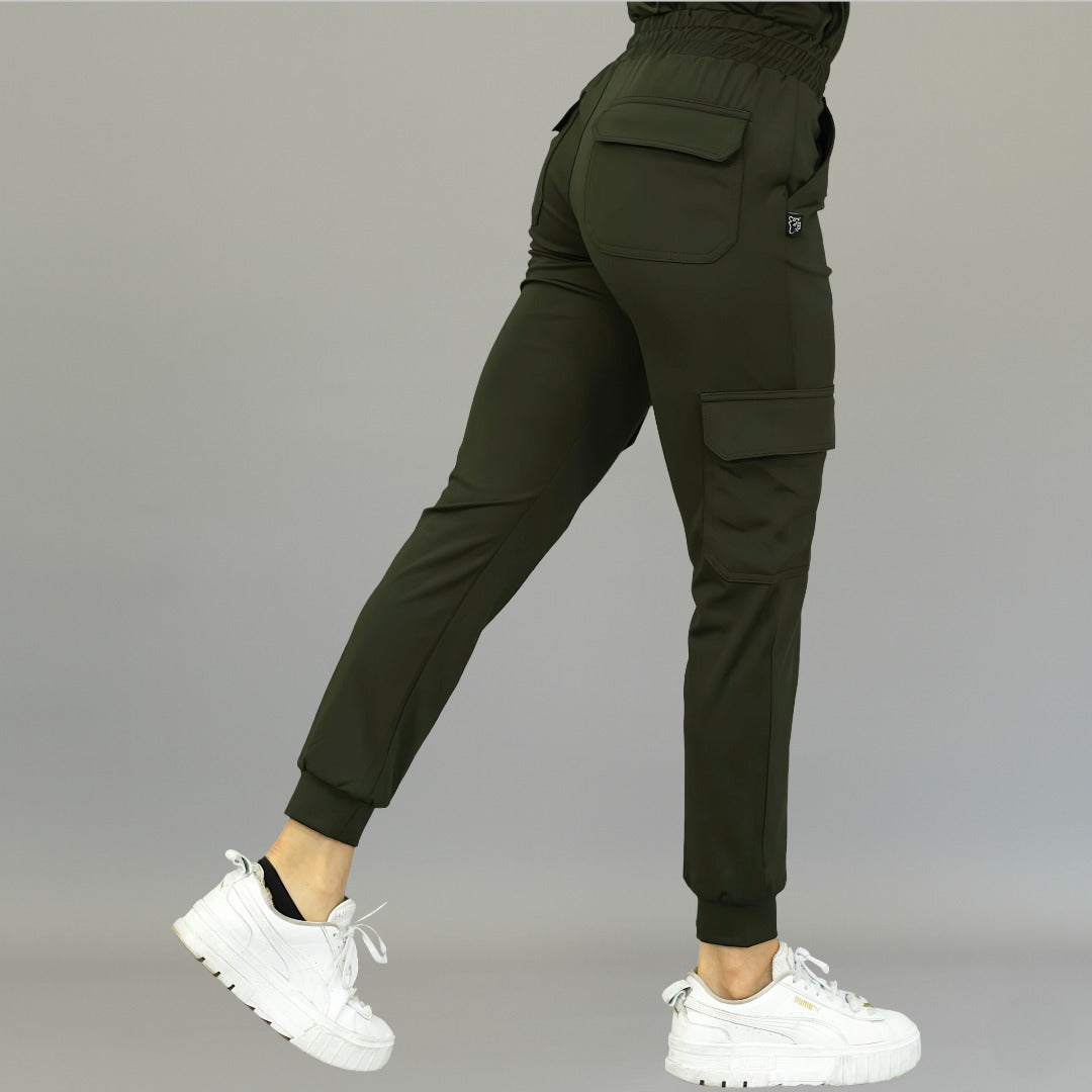 Back-side angle showing olive green women's jogger pants 910 with one leg extended backward.