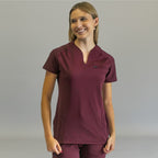 Women's Style 915 maroon scrub top, front view, smiling model