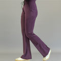 Women's Style 915 purple flare scrub pants, side profile view showing stretch fit