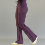 Women's Style 915 purple flare scrub pants, side profile view showing stretch fit
