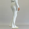 Women's white flare scrub pants, back three-quarter view