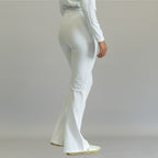 Women's white flare scrub pants, back three-quarter view