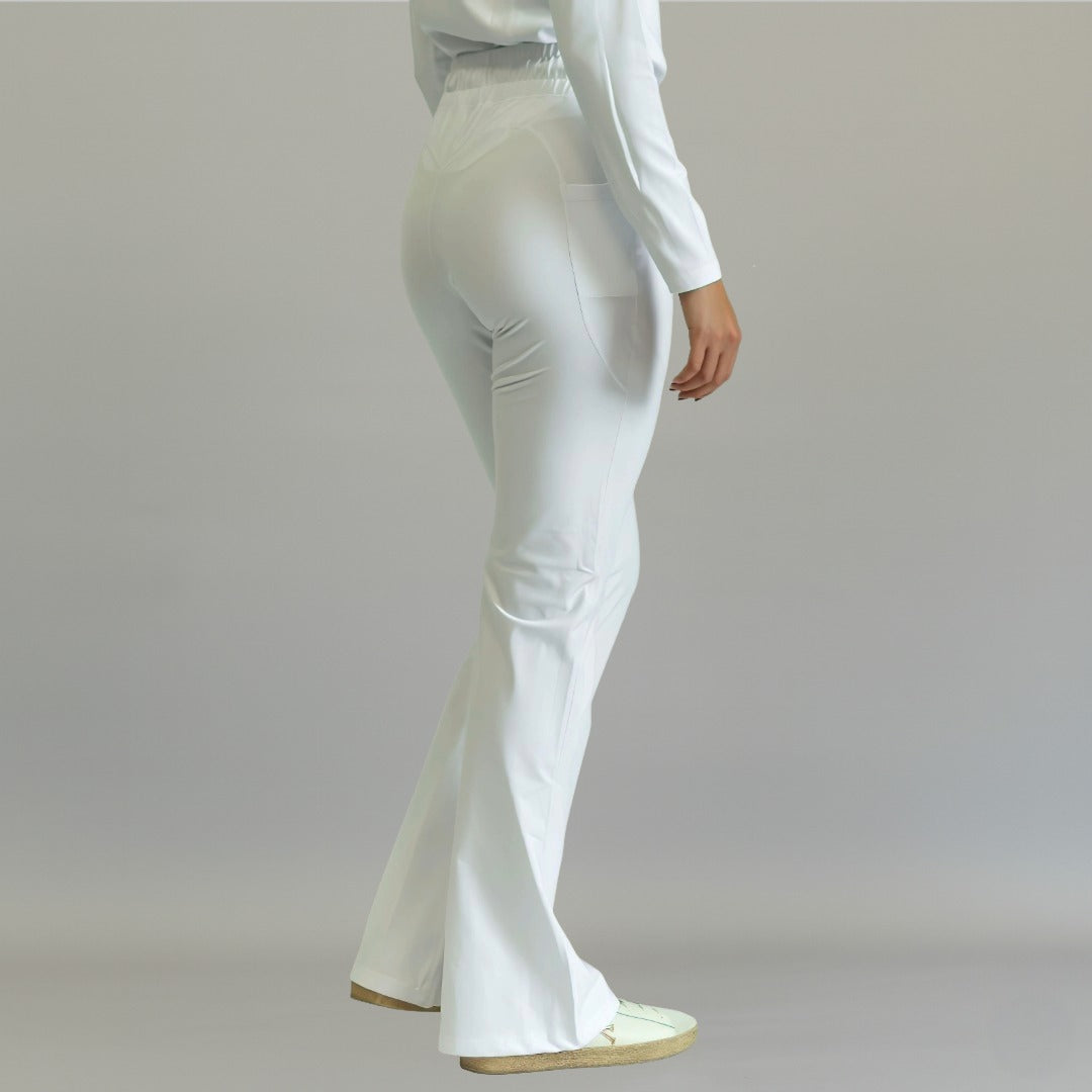 Women's white flare scrub pants, back three-quarter view