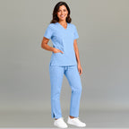 Women's sky blue 502 scrub pants complete with top pose  — lightweight fluid-resistant medical scrub pants S-FOR-ME