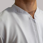 Mens white fluid-resistant Mandarin collar scrub top with front zipper - SFORME