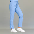 Side view of women's 502 sky blue scrub pants showing cargo pocket detail — lightweight fluid-resistant nursing pants by S-FOR-ME