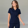Women's navy blue lightweight scrub top 502 with V-neck crossover and patch pockets — S-FOR-ME fluid-resistant medical uniform