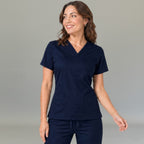 Women's navy blue lightweight scrub top 502 with V-neck crossover and patch pockets — S-FOR-ME fluid-resistant medical uniform