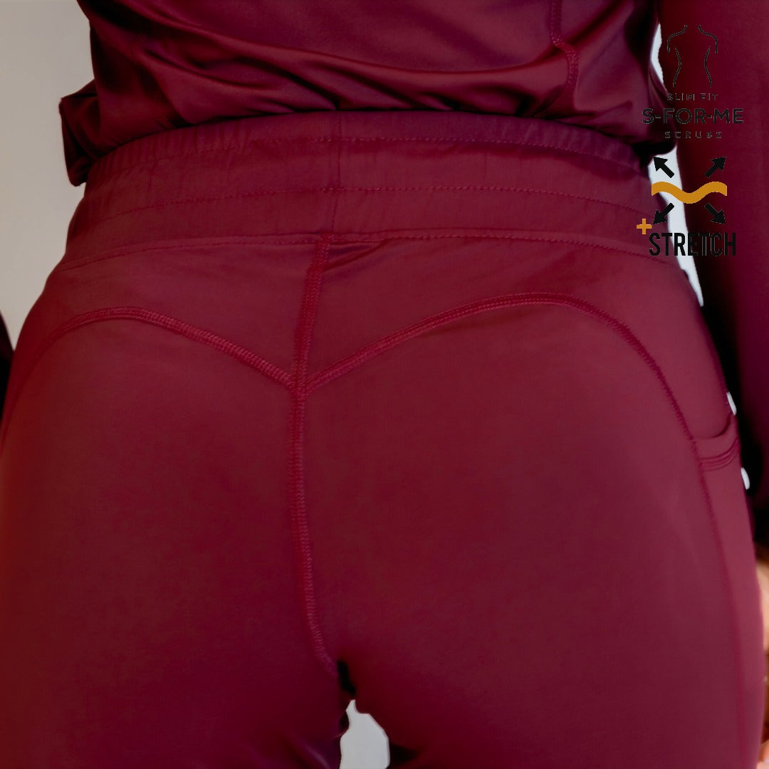 Close-up back view of Women’s 915 Super Stretch maroon scrub pants showing waistband and seam details