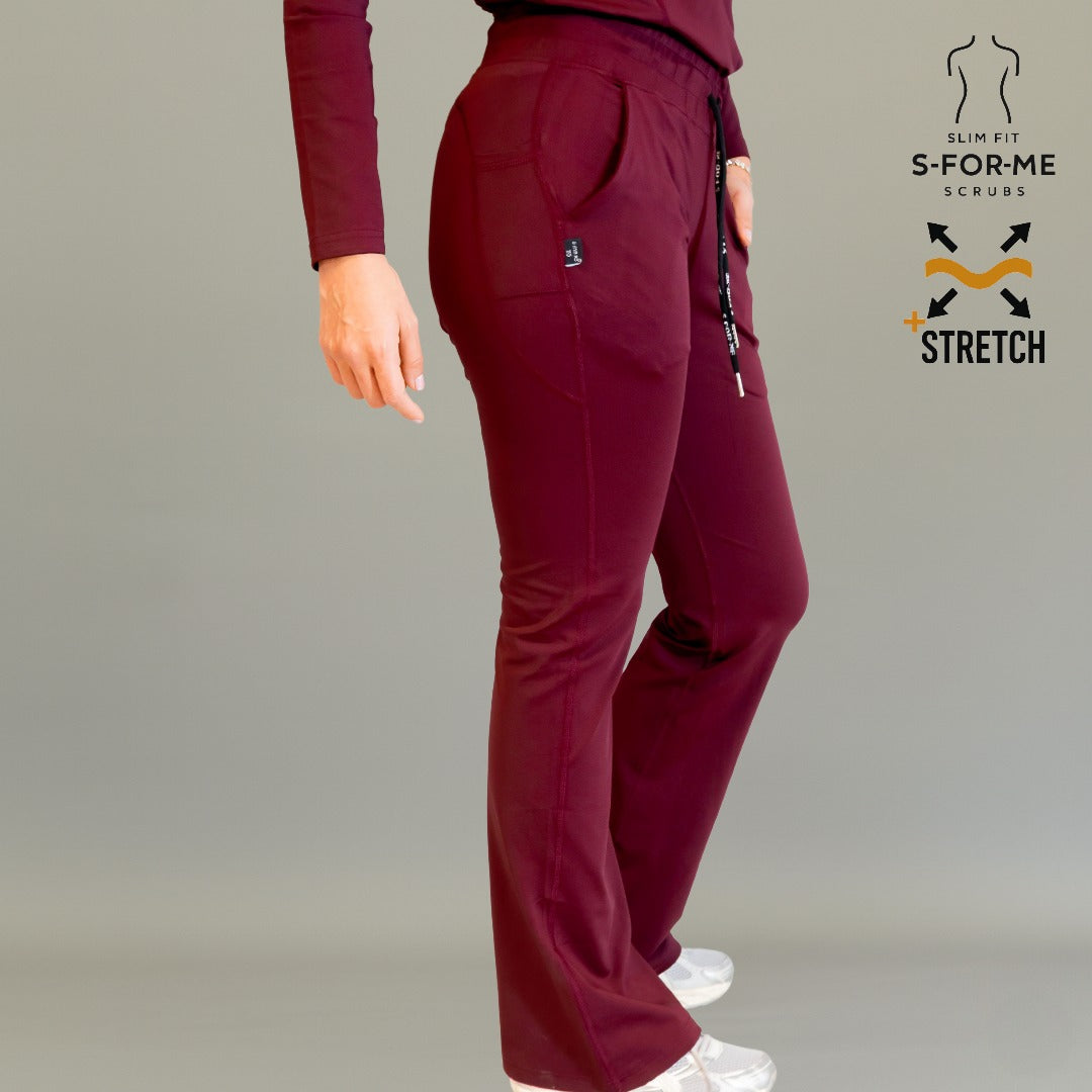 Women’s 915 Super Stretch maroon flare scrub pants side view showing stretch fit and flare leg