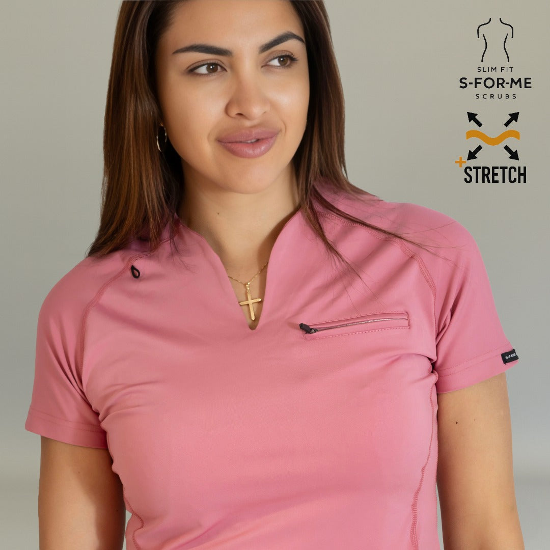Close-up of Women’s 915 Mauve Rose scrub top with V-neck, chest zipper pocket, and shoulder snap details
