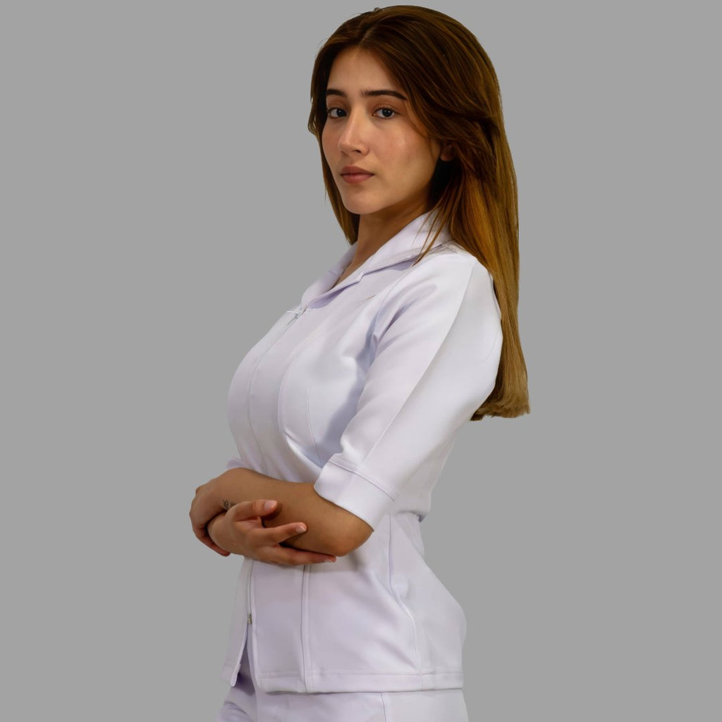 Three-quarter view of womens Alviero white zip scrub top, fluid-resistant medical uniform - SFORME